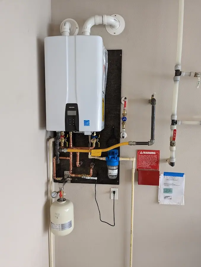 Professional plumber installing copper piping in a North Merritt Island home